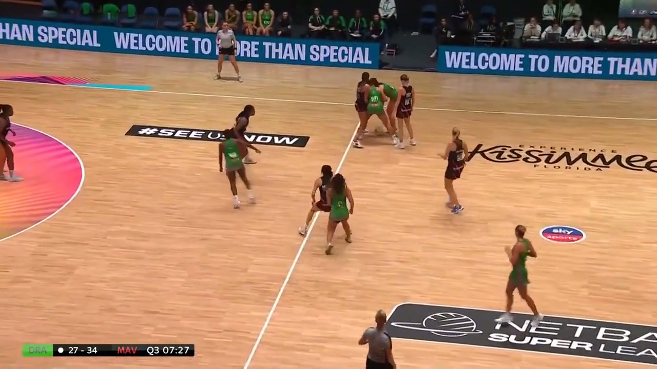 Full frame at the moment the ball is passed, showing the two attacking players close together in midcourt